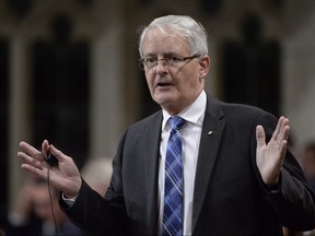 Grain farmers in Western Canada say billions of dollars are at stake unless the government pushes forward with a fix to address a serious shortage of rail cars to move crops to market. Transport Minister Marc Garneau rises in the House of Commons in Ottawa on Tuesday, October 24, 2017. THE CANADIAN PRESS/Adrian Wyld