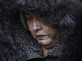 Tears roll downtime cheeks of Thelma Favel, Tina Fontaine's great-aunt and the woman who raised her, during a march Friday, February 23, 2018, in Winnipeg the day after the jury delivered a not-guilty verdict in the second degree murder trial of Raymond Cormier. When Thelma Favel woke up each morning before going to the court house in Winnipeg, she looked around her room and wondered what Tina Fontaine thought when she stayed in the same hotel in her final weeks alive. THE CANADIAN PRESS/John Woods