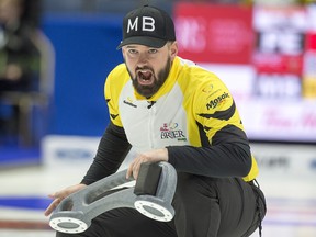 Manitoba skip Reid Carruthers calls the sweep as they play Prince Edward Island at the Tim Hortons Brier curling championship at the Brandt Centre in Regina on Saturday, March. 3, 2018. THE CANADIAN PRESS/Andrew Vaughan ORG XMIT: XAV103