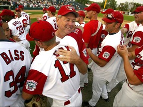 Goldeyes manager Hal Lanier and outfielder Chris Cox celebrate a playoff series win. The Goldeyes are retiring Lanier's number. Winnipeg Sun files