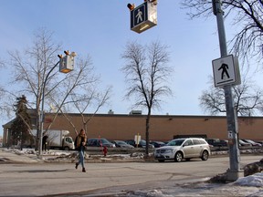 A Grant Park High School student crosses at a pedestrian corridor on Monday, March 19. CAA and the Winnipeg Police Service are asking both drivers and pedestrians to stay alert as spring break approaches. Scott Billeck/Winnipeg Sun