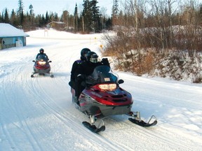 RCMP believe two men died of exposure after they and another man went snowmobiling near a remote community in northwestern Manitoba.