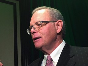 Sanford Riley, former board chair at Manitoba Hydro, speaks to reporters after a speech to business leaders in Winnipeg on Friday, Dec. 1, 2017. A day after all but one of Manitoba Hydro's board of directors resigned, now-former board chairman Riley defended an agreement with the Manitoba Metis Federation at the heart of the dispute between the board and the Manitoba government. THE CANADIAN PRESS/Steve Lambert