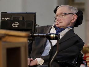 FILE - In this March 6, 2017 file photo, Britain's Professor Stephen Hawking delivers a keynote speech as he receives the Honorary Freedom of the City of London during a ceremony at the Guildhall in the City of London. Hawking, whose brilliant mind ranged across time and space though his body was paralyzed by disease, has died, a family spokesman said early Wednesday, March 14, 2018.