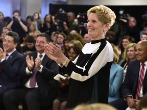 Ontario Premier Kathleen Wynne applauds staff and patients during a CAMH mental health funding announcement in Toronto on Wednesday March 21, 2018. THE CANADIAN PRESS/Frank Gunn