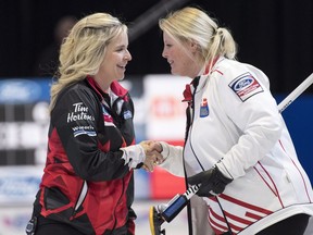 Canada skip Jennifer Jones is congratulated by Denmark skip Angelina Jensen following their win at the World Women's Curling Championship Tuesday, March 20, 2018 in North Bay, Ont.