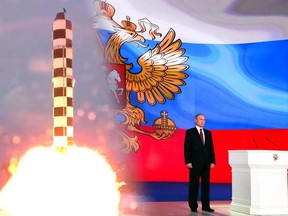 Russian President Vladimir Putin stands after giving his annual state of the nation address in Manezh in Moscow, Russia, Thursday, March 1, 2018.