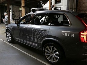 In this Dec. 13, 2016 file photo, an Uber driverless car is displayed in a garage in San Francisco.