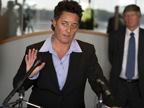 In this Sept. 28, 2015, file photo, former University of Minnesota Duluth women's hockey coach Shannon Miller speaks about the discrimination lawsuit she and two other female coaches have filed against the school, at the law offices of Fafinski Mark & Johnson in Eden Prairie, Minn. (Richard Tsong-Taatarii/Star Tribune via AP, File)