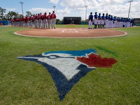 Toronto Blue Jays and Philadelphia Phillies line up prior to spring training action in Dunedin, Fla. on Feb. 23, 2018