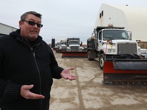 Public Works communications officer Ken Allen outlines the city's approach to an anticipated snowstorm at the department's yard on Pacific Avenue in Winnipeg on Sunday.