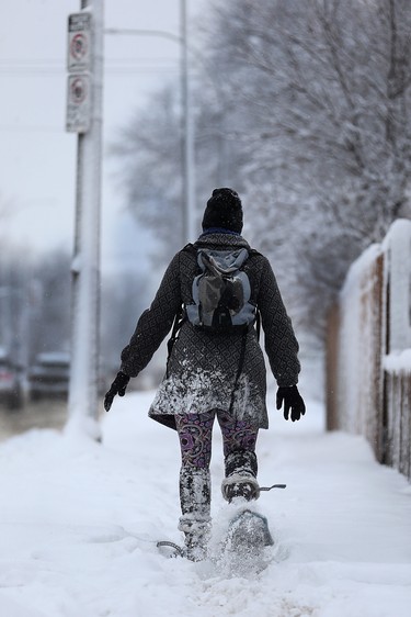 Rachael Kroeker snowshoes along Stafford Street in Winnipeg on Mon., March 5, 2018. Kevin King/Winnipeg Sun/Postmedia Network