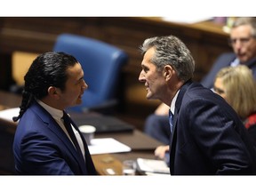 Premier Brian Pallister (right) and Opposition Leader Wab Kinew have a discussion prior to the opening of the spring session of the Manitoba Legislature Building in Winnipeg on Wed., March 7, 2018. Kevin King/Winnipeg Sun/Postmedia Network
