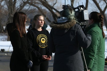 Event co-chairs Megan Parsons (second from left) and Ashley-Rose Aseltine talk up the 5 Days for the Homeless event during the Fivehole for Five Days street hockey tournament in a parking lot on the University of Manitoba's Fort Garry Campus in Winnipeg on Sun., March 11, 2018. The 5 Days for the Homeless campaign is raising funds for Resource Assistance for Youth. Kevin King/Winnipeg Sun/Postmedia Network