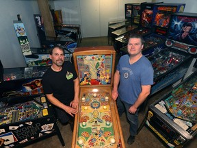 Mark Jaslowski (left) and Dave Morris are sharing their love of pinball with a 20-game pop-up arcade at Forth on McDermot Avenue in Winnipeg. Pictured on Wed., March 15, 2018. Kevin King/Winnipeg Sun/Postmedia Network