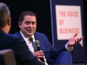 Conservative Party of Canada leader Andrew Scheer (right) takes part in a Q&A with Manitoba Chambers of Commerce president/CEO Chuck Davidson during its luncheon at the Metropolitan Entertainment Centre in Winnipeg on Mon., March 19, 2018. Kevin King/Winnipeg Sun/Postmedia Network