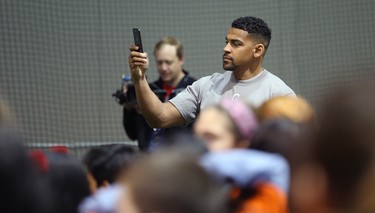 Winnipeg Blue Bombers running back Andrew Harris records for social media during a Jumpstart event at the RBC Convention Centre that is part of CFL Week in Winnipeg on Thurs., March 22, 2018. Over 150 kids from Greenway and Victory schools were able to participate in drills with current CFL stars. Kevin King/Winnipeg Sun/Postmedia Network