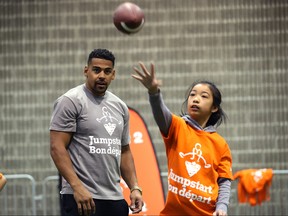 Winnipeg Blue Bombers running back Andrew Harris watches students catching and throwing during a Jumpstart event at the RBC Convention Centre that is part of CFL Week in Winnipeg on Thurs., March 22, 2018. Over 150 kids from Greenway and Victory schools were able to participate in drills with current CFL stars. Kevin King/Winnipeg Sun/Postmedia Network