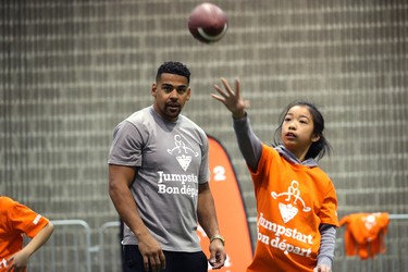 Winnipeg Blue Bombers running back Andrew Harris watches students catching and throwing during a Jumpstart event at the RBC Convention Centre that is part of CFL Week in Winnipeg on Thurs., March 22, 2018. Over 150 kids from Greenway and Victory schools were able to participate in drills with current CFL stars. Kevin King/Winnipeg Sun/Postmedia Network