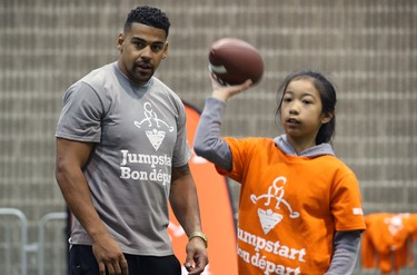 Winnipeg Blue Bombers running back Andrew Harris watches students catching and throwing during a Jumpstart event at the RBC Convention Centre that is part of CFL Week in Winnipeg on Thurs., March 22, 2018. Over 150 kids from Greenway and Victory schools were able to participate in drills with current CFL stars. Kevin King/Winnipeg Sun/Postmedia Network