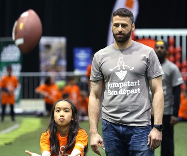 Edmonton Eskimos quarterback Mike Reilly watches students throw and catch during a Jumpstart event at the RBC Convention Centre that is part of CFL Week in Winnipeg on Thurs., March 22, 2018. Over 150 kids from Greenway and Victory schools were able to participate in drills with current CFL stars. Kevin King/Winnipeg Sun/Postmedia Network