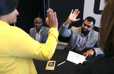 Former Winnipeg Blue Bombers Milt Stegall (left) and Obby Khan interact with students during an autograph session at RBC Convention Centre in Winnipeg on Thurs., March 22, 2018 that is part of CFL Week. Kevin King/Winnipeg Sun/Postmedia Network