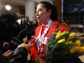 Jill Officer, second for the Jennifer Jones team which won gold at the world curling championship in North Bay, Ont., on Sunday, speaks with media upon arrival at the Winnipeg International Airport on Mon., March 26, 2018. Kevin King/Winnipeg Sun/Postmedia Network