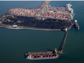 Ships are loaded with coal at Westshore Terminals in Delta, B.C., on Wednesday February 19, 2014. The terminal is North America's largest single coal export facility.