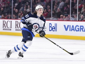 MONTREAL, QC - APRIL 03:  Sami Niku #83 of the Winnipeg Jets skates against the Montreal Canadiens in his first NHL game at the Bell Centre on April 3, 2018 in Montreal, Quebec, Canada.  (Photo by Minas Panagiotakis/Getty Images)