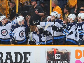The Winnipeg Jets bench reacts after Markl Scheifele's open net goal against the Nashville Predators during the third period of a 4-1 Jets victory in Game 1 Friday.