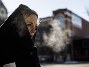Sheena Trudel's breath can be seen as she walks along Whyte Ave in Edmonton on Monday April 2, 2018. Edmonton hit a low of - 17 celsius on Easter Monday.