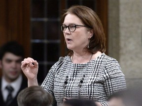 Minister of Indigenous Services Jane Philpott rises during Question Period in the House of Commons on Parliament Hill in Ottawa on Friday, Feb. 9, 2018. Canada's Indigenous services minister says Ottawa has fully complied with the orders of a 2016 ruling from the Canadian Human Rights Tribunal which said the federal government discriminates against Indigenous children.