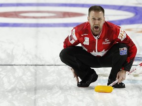 Canada skip Brad Gushue directs sweepers during a qualification game against the United States during the World Men's Curling Championship, Saturday, April 7, 2018, in Las Vegas. (AP Photo/John Locher)