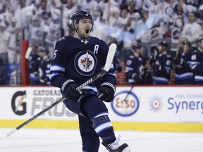 Winnipeg Jets' Mark Scheifele (55) celebrates his goal against the Minnesota Wild during Game 1, one of the top 10 moments of the Jets' first-round series.