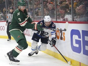 Minnesota Wild center Charlie Coyle (3) defends against Winnipeg Jets defenseman Josh Morrissey (44) in the first period of Game 3. Morrissey is one of 11 players on the Jets playoff roster — all aged 25 or younger — who were drafted by the team since 2011.