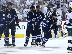 The Winnipeg Jets celebrate a goal from Bryan Little (18) during their Game 5 and series victory over the Minnesota Wild. (Kevin King/Winnipeg Sun)
