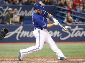 Russell Martin of the Toronto Blue Jays hits a two-run home run in the seventh inning against the Chicago White Sox at Rogers Centre on April 2, 2018