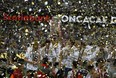 Chivas holds the trophy aloft as the celebrate winning the CONCACAF Champions League final soccer match in Guadalajara, Mexico, Wednesday, April, 25, 2018. Chivas defeated Toronto FC in a penalty shoot out. (AP Photo/Eduardo Verdugo) ORG XMIT: XEV140