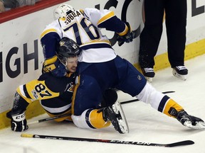 Nashville Predators' P.K. Subban (76) tangles with Pittsburgh Penguins' Sidney Crosby (87) during the first period in Game 5 of the NHL hockey Stanley Cup Final, Thursday, June 8, 2017, in Pittsburgh. (AP Photo/Gene J. Puskar) ORG XMIT: PAWS117