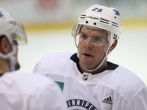 Paul Stastny speaks with a teammate during Jets practice at Bell MTS Iceplex on Tuesday. (Kevin King/Winnipeg Sun)