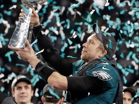 Philadelphia Eagles' Nick Foles holds up the Vince Lombardi Trophy after the NFL Super Bowl 52 football game against the New England Patriots on April 18, 2018