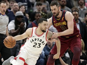 Toronto Raptors guard Fred VanVleet (23) drives against Cleveland Cavaliers' Kevin Love (0) Wednesday, March 21, 2018, in Cleveland. (AP Photo/Tony Dejak)