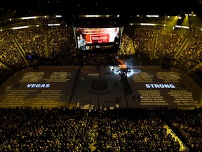Names of the 58 victims of the October 1, 2017 mass shooting in Las Vegas are projected on the ice as the Vegas Golden Knights hang a banner in the rafters with 58 stars and the names of all the victims of the shooting as they retire the number 58 in honor of the 58 victims before a game against the San Jose Sharks at T-Mobile Arena on March 31, 2018 in Las Vegas, Nevada. (Ethan Miller/Getty Images)