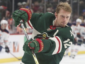 In this April 2, 2018, photo, Minnesota Wild's Eric Staal warms up before an NHL hockey game against the Edmonton Oilers in St. Paul, Minn. Last week, Staal hit the 40-goal mark, joining the great Gordie Howe as the only players in NHL history to post 40-goal seasons at least nine years apart with none in between. (AP Photo/Jim Mone) ORG XMIT: MNJM201