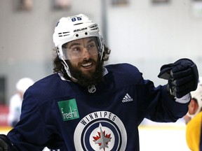 Mathieu Perreault laughs during Winnipeg Jets practice at Bell MTS Iceplex on Mon., April 9, 2018. Kevin King/Winnipeg Sun/Postmedia Network