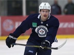 Andrew Copp has his tongue wagging during Winnipeg Jets practice at Bell MTS Iceplex on Tuesday.