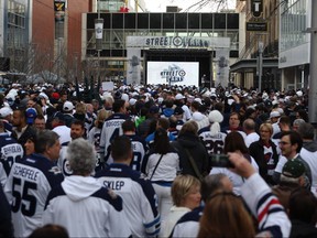 People crowd Donald Street for the Winnipeg Whiteout Street Party on Wed., April 11, 2018. Kevin King/Winnipeg Sun/Postmedia Network