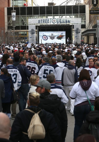 People crowd Donald Street for the Winnipeg Whiteout Street Party on Wed., April 11, 2018. Kevin King/Winnipeg Sun/Postmedia Network