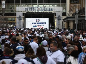 People crowd Donald Street for the Winnipeg Whiteout Street Party on Wed., April 11, 2018. The total cost of putting on the street parties came close to $2.2 million.