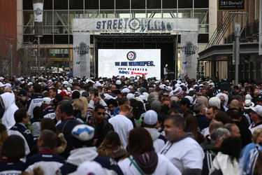 People crowd Donald Street for the Winnipeg Whiteout Street Party on Wed., April 11, 2018. Kevin King/Winnipeg Sun/Postmedia Network